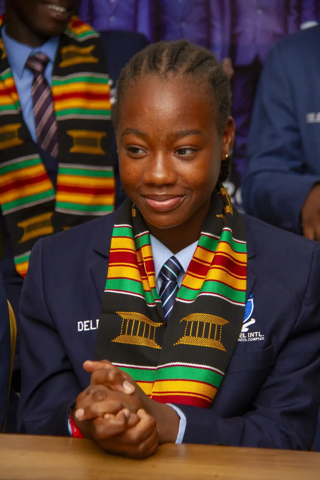 An AVATI member in programme blazer and delegate sash at the East Legon venue.
